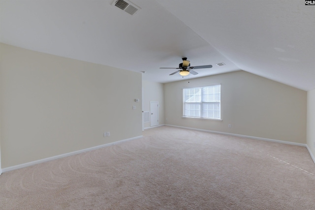 bonus room featuring ceiling fan, vaulted ceiling, and light carpet