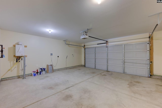 garage with a garage door opener and tankless water heater