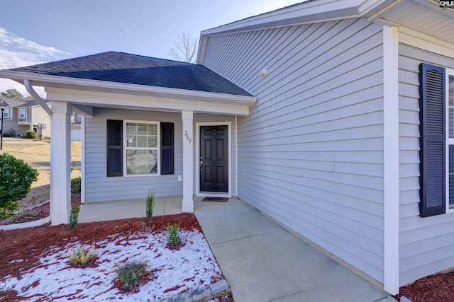 entrance to property featuring covered porch