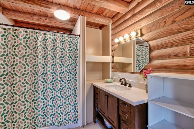 bathroom with beamed ceiling, vanity, log walls, and wood ceiling