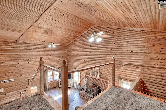 unfurnished living room featuring log walls, high vaulted ceiling, and wood ceiling