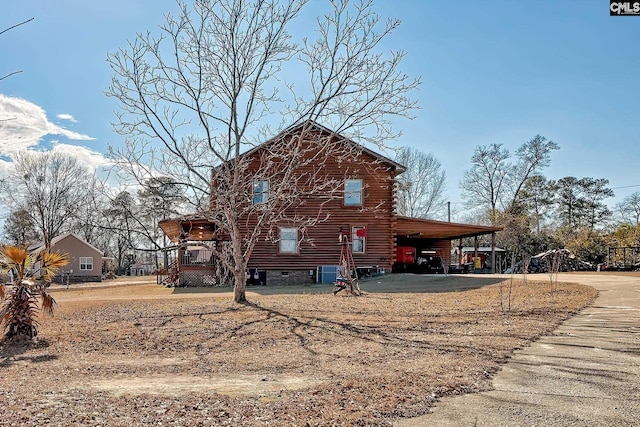 view of home's exterior featuring a carport