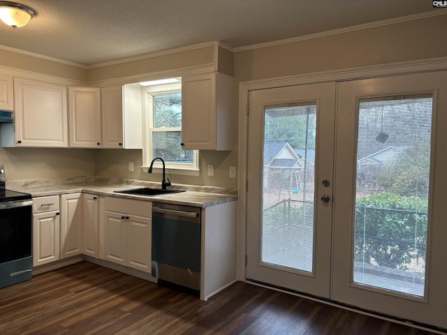 kitchen featuring sink, stainless steel appliances, a textured ceiling, white cabinets, and french doors