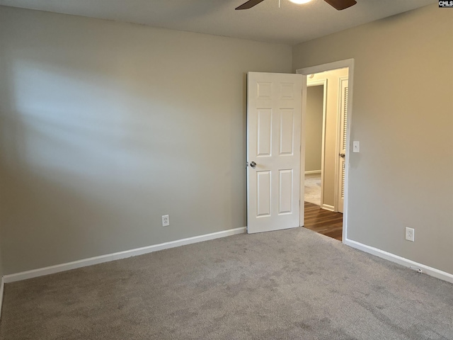 empty room with carpet and ceiling fan