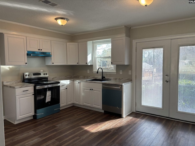 kitchen with stainless steel appliances, sink, white cabinets, and dark hardwood / wood-style flooring