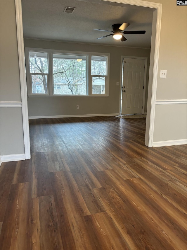 interior space featuring ceiling fan and dark hardwood / wood-style flooring