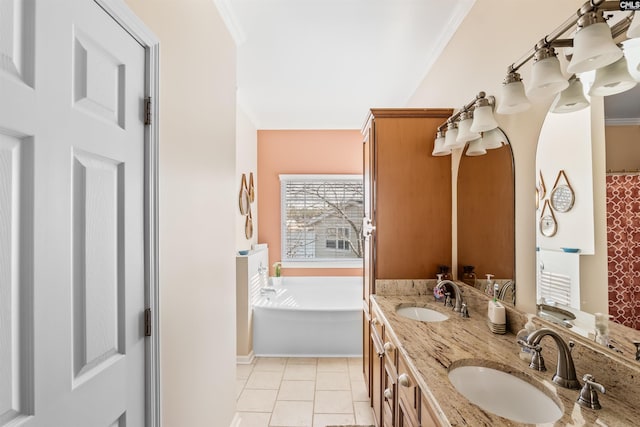 bathroom featuring vanity, ornamental molding, tile patterned floors, and a bathing tub