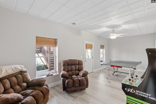 game room featuring plenty of natural light, light hardwood / wood-style floors, and ceiling fan