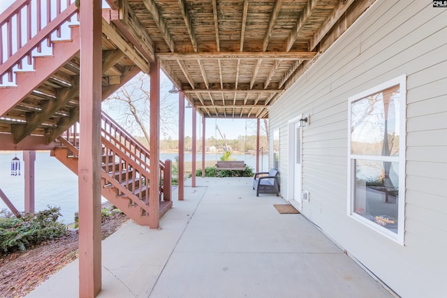 view of patio featuring a water view