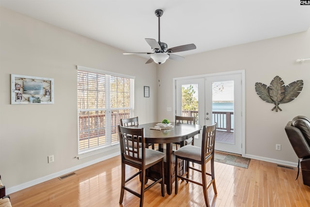 dining area featuring french doors, ceiling fan, and light hardwood / wood-style floors