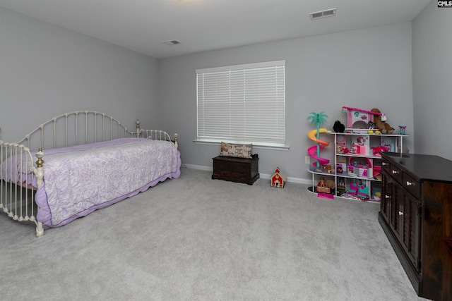 bedroom featuring light colored carpet