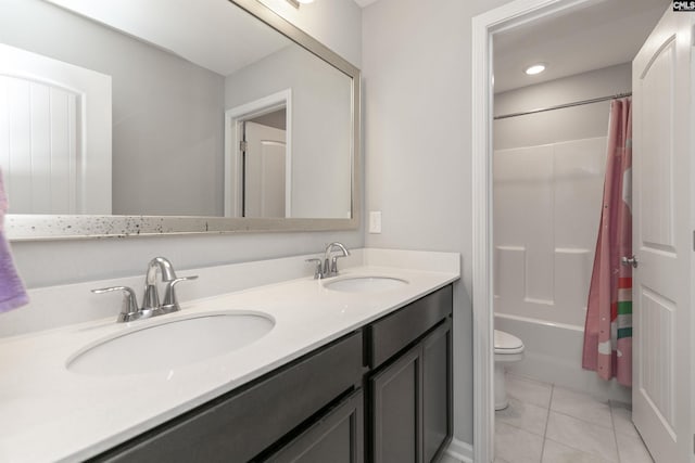 full bathroom featuring vanity, shower / bathtub combination with curtain, tile patterned floors, and toilet