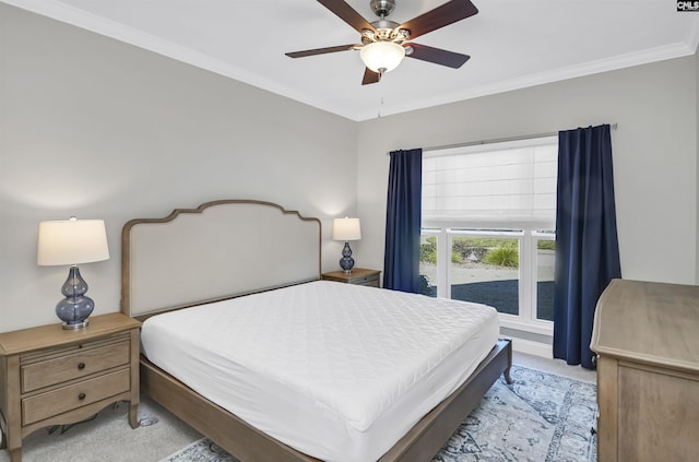 bedroom featuring light carpet, crown molding, and ceiling fan