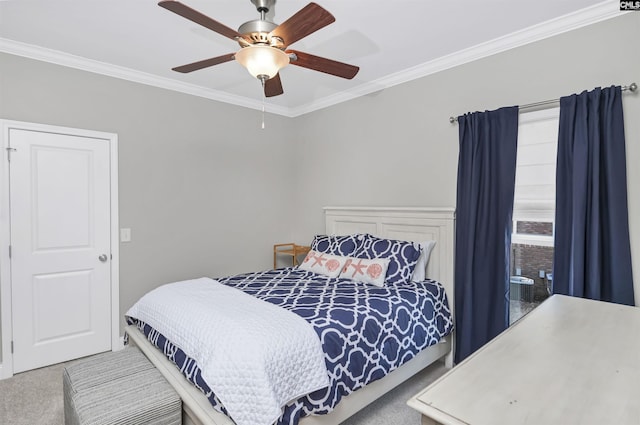 bedroom featuring crown molding, carpet, and ceiling fan