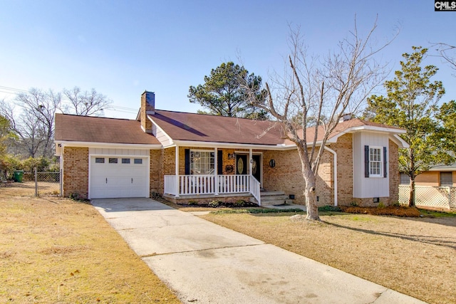 single story home featuring a garage, a front yard, and covered porch