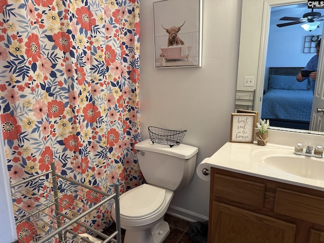 bathroom with ceiling fan, vanity, toilet, and tile patterned floors