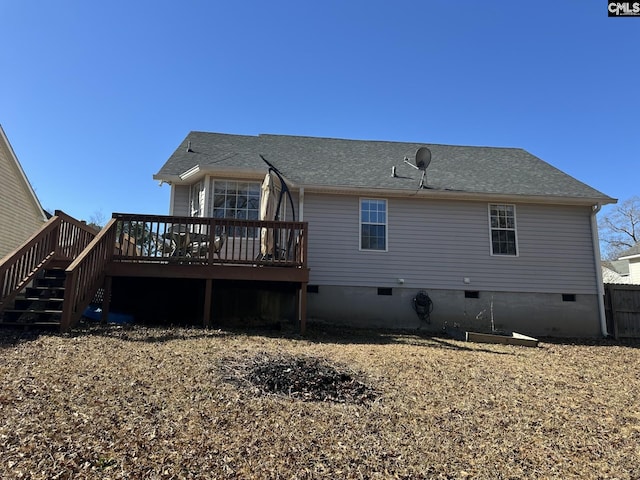 back of house with a wooden deck