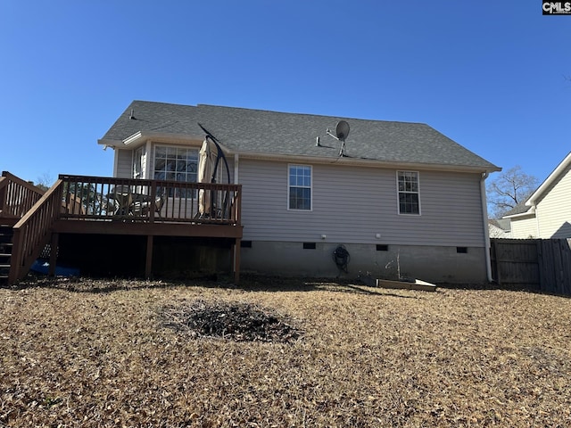 rear view of property featuring a deck