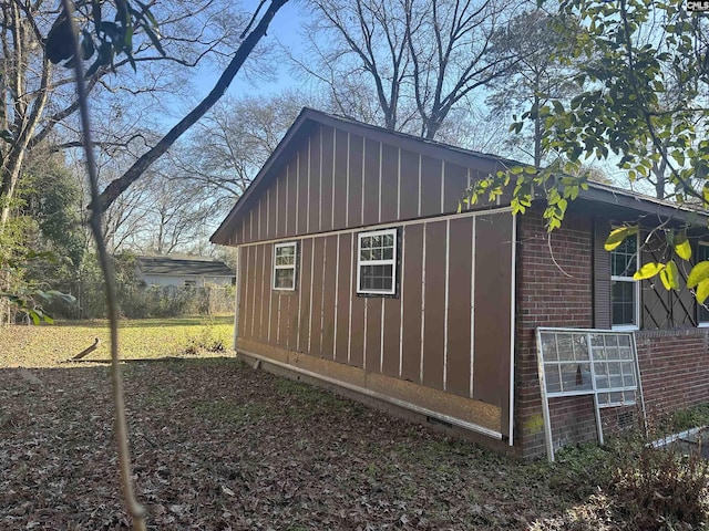 view of home's exterior with an outbuilding