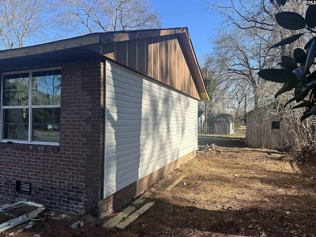 view of home's exterior featuring a shed