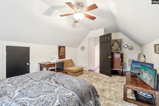 bedroom with vaulted ceiling, carpet floors, and ceiling fan