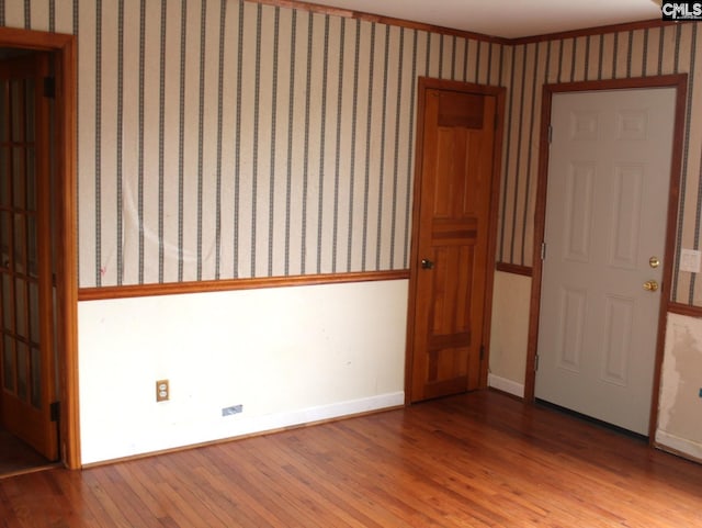 unfurnished room with light hardwood / wood-style flooring