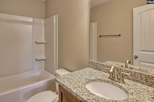 full bathroom featuring vanity, bathtub / shower combination, and toilet