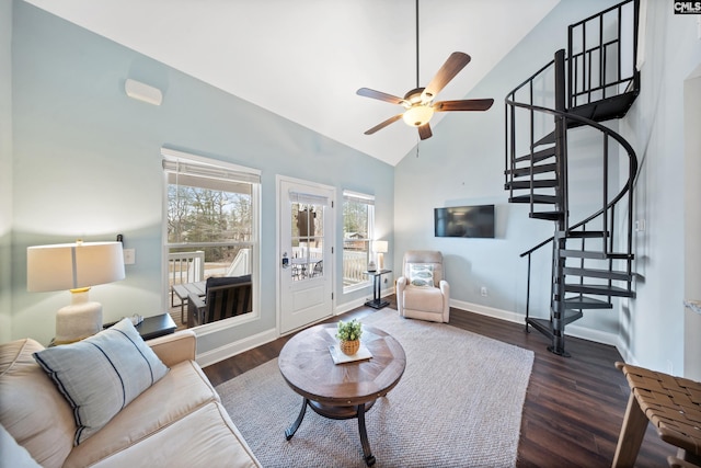 living room with ceiling fan, dark hardwood / wood-style floors, and vaulted ceiling