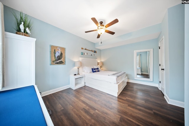 unfurnished bedroom featuring dark hardwood / wood-style floors and ceiling fan