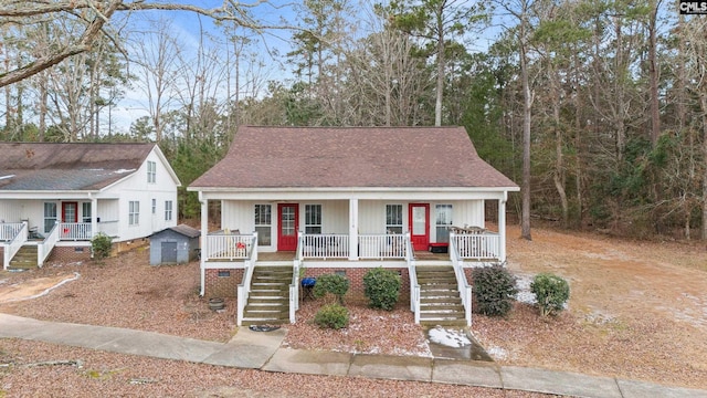 view of front of property with a porch and a storage unit