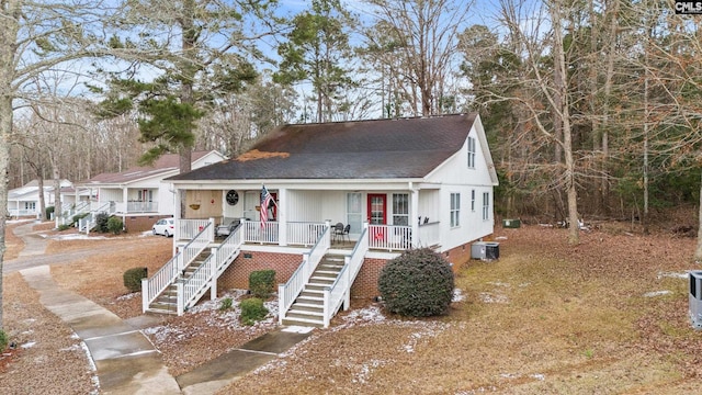 view of front of property with cooling unit and covered porch