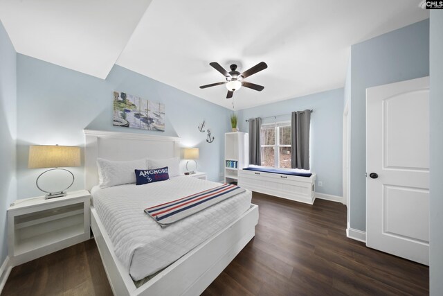 bedroom with ceiling fan and dark hardwood / wood-style flooring