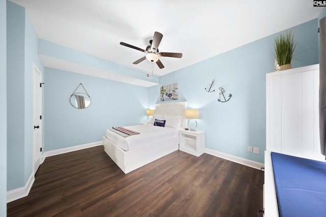 unfurnished bedroom with dark wood-type flooring and ceiling fan