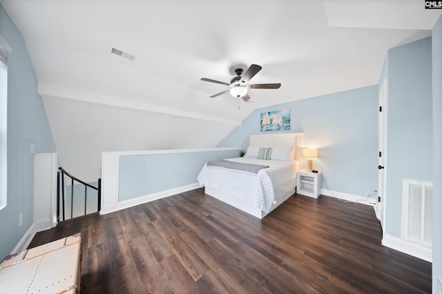 bedroom with ceiling fan, lofted ceiling, and dark hardwood / wood-style floors