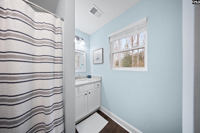 bathroom with wood-type flooring and vanity