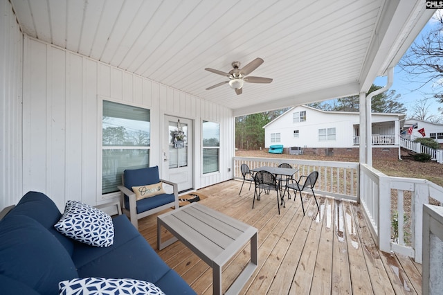 wooden terrace featuring ceiling fan