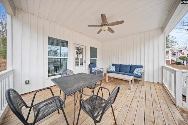 deck featuring ceiling fan and an outdoor hangout area