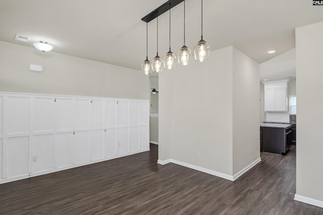 unfurnished dining area with dark hardwood / wood-style floors