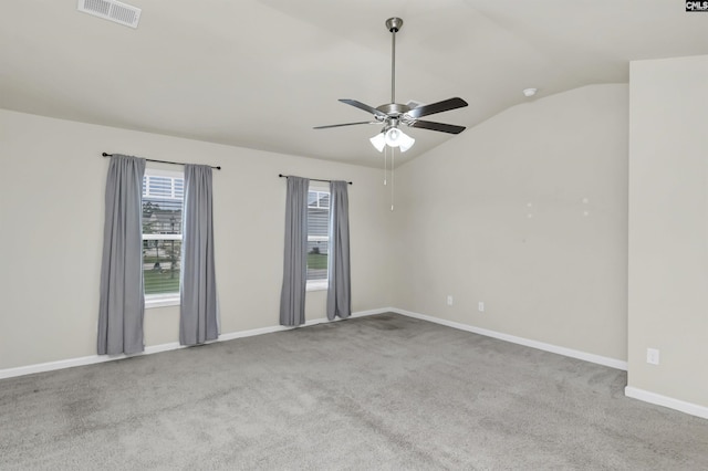 carpeted spare room with lofted ceiling and ceiling fan