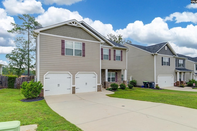 view of front of house with a garage and a front lawn