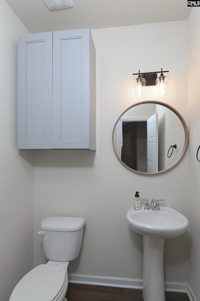 bathroom with toilet and sink