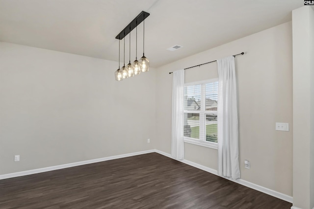 empty room with dark hardwood / wood-style floors