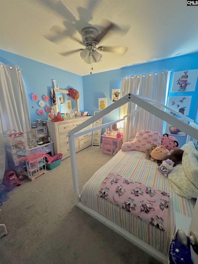 carpeted bedroom featuring ceiling fan