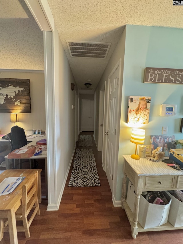 hallway with dark hardwood / wood-style flooring