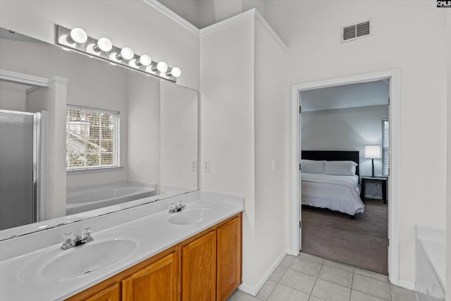 bathroom with tile patterned flooring, vanity, and independent shower and bath