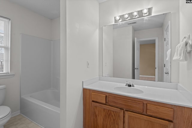 full bathroom with shower / tub combination, vanity, and toilet