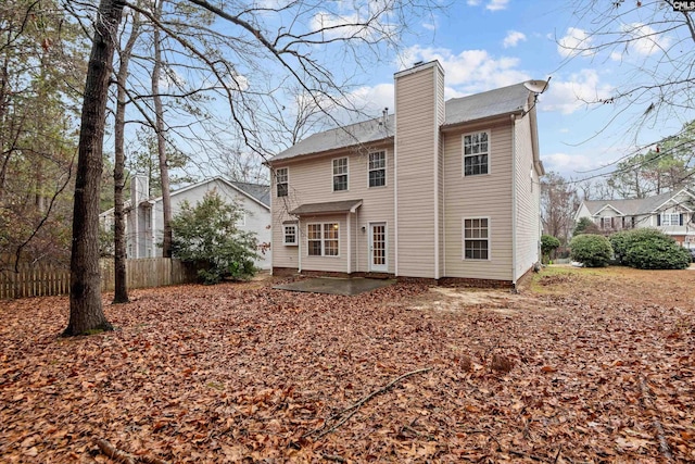 rear view of property featuring a patio area