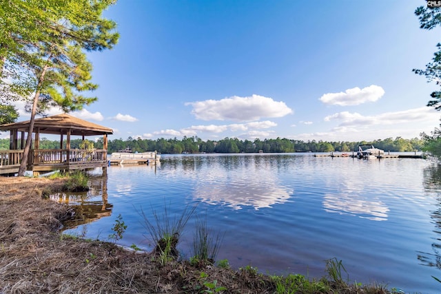 property view of water with a gazebo and a boat dock