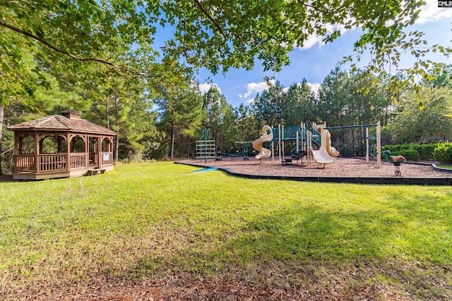 view of play area with a gazebo and a lawn