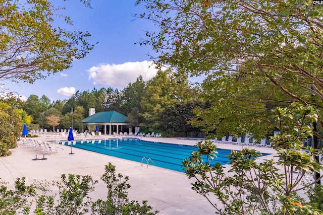 view of swimming pool featuring a gazebo and a patio